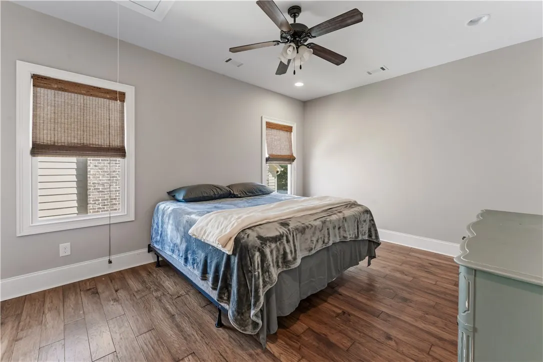 Rich wood floors and recessed lighting enhance this comfortable and inviting retreat.