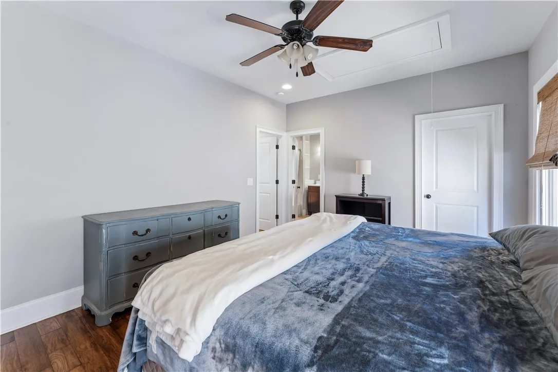 Rich hardwood flooring and clean crown molding enhance this peaceful, private suite.