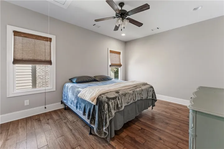 Rich wood floors and recessed lighting enhance this comfortable and inviting retreat.