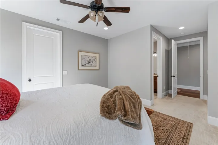 Soft carpet and clean architectural lines define this serene private sanctuary.