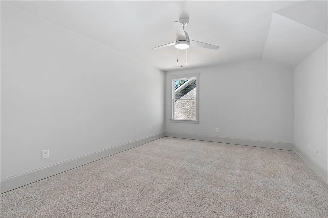 Crisp walls and plush carpeting define this versatile upper-level space.