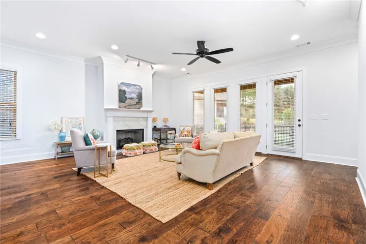 Open sightlines connect the kitchen, dining area, and living room.