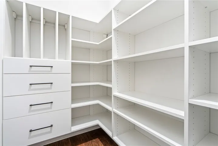 The pantry is outfitted with a custom storage system.