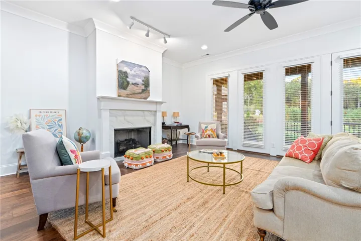 The living room is an inviting gathering space that extends outdoors when the door is opened.