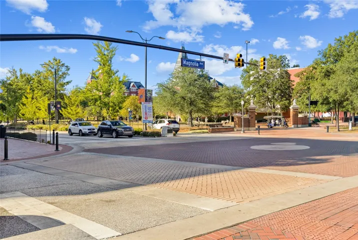 A picturesque brick-paved intersection highlights the vibrant town center near the campus entrance.