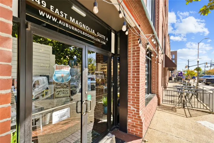Classic brick storefront architecture anchors this vibrant pedestrian-friendly streetscape.
