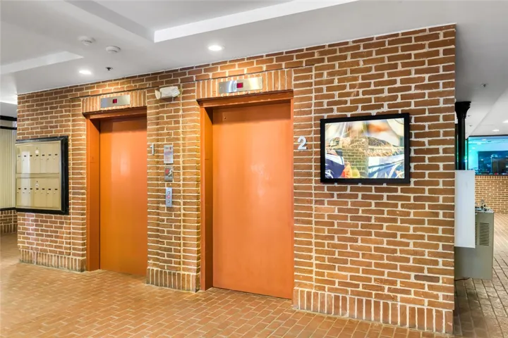 Industrial design elements elevate this common area with classic brickwork and clean lines.