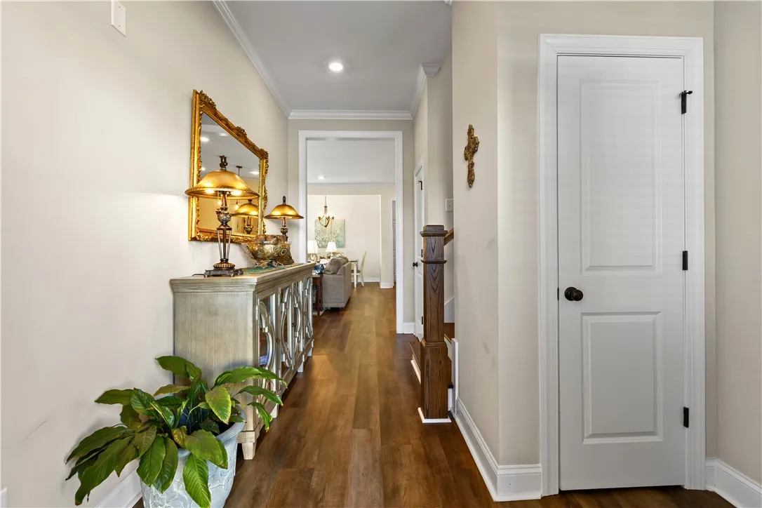 Foyer with coat & storage closet plus stairs to second level.