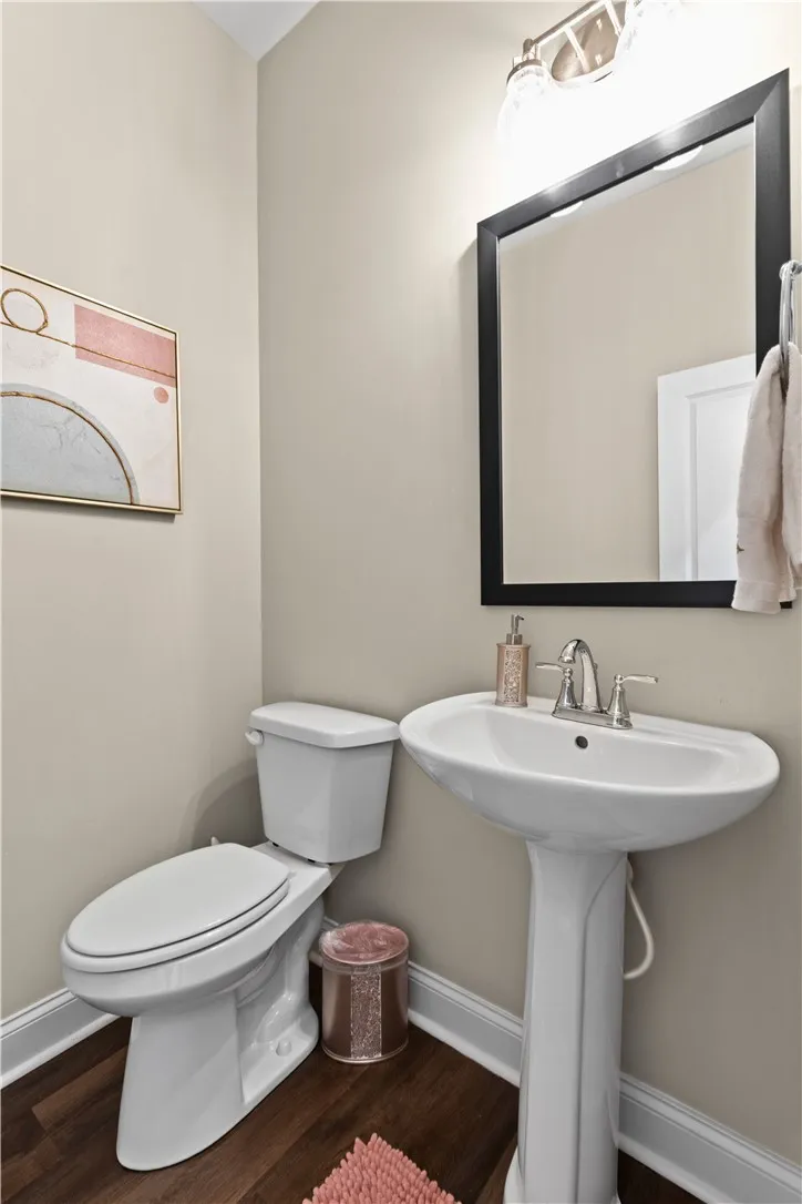 Half bath downstairs btwn garage & kitchen.