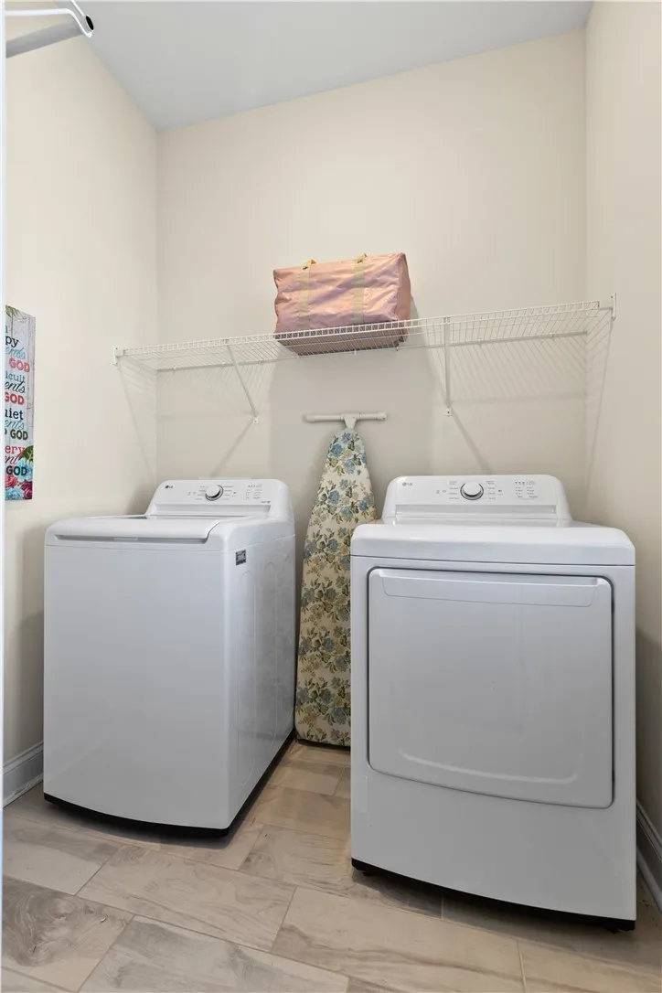 Full laundry room on first floor tucked around off the foyer.