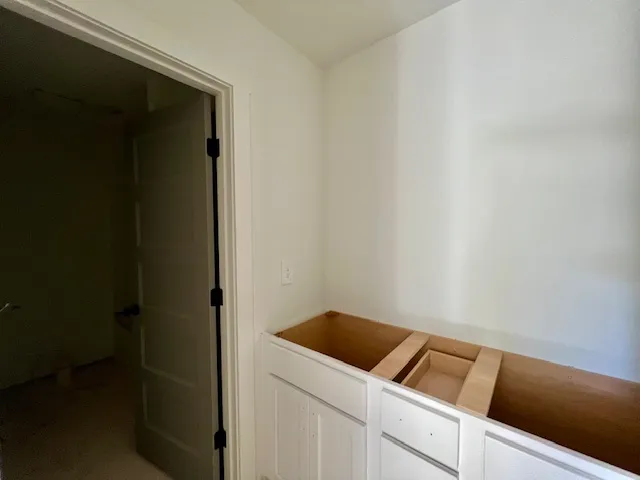 A spacious bathroom under construction reveals potential for custom dual vanities.