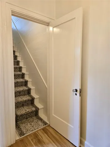 Hidden staircase to 3rd bedroom and attic storage