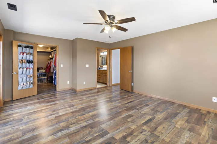 Walk in closet offers lots of shelves and storage!