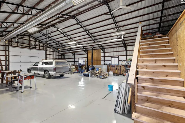 Steel Shop and balcony storage above office/storage rooms. Over head fans move lots of air!