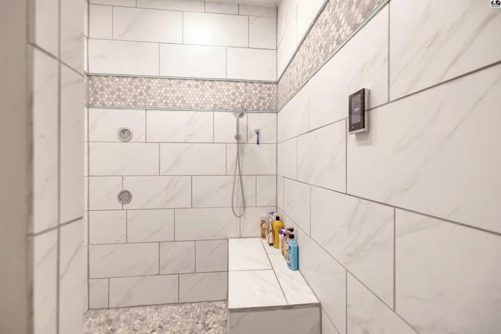 Master bathroom shower with 6 sprays, rain head, shower head and personal hand spray.