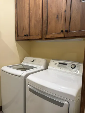 Laundry room located one main floor with wood floors.
