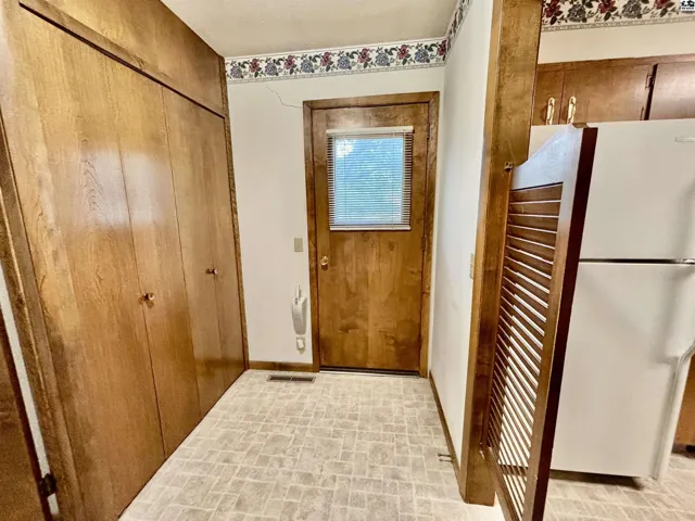 Great storage in the mud room off the kitchen, laundry is on opposite wall. Door to backyard.