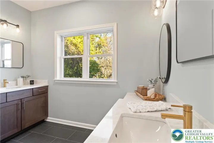 *Photos are of a previously built model and may contain upgrades not included in the base price* Owner's Bath