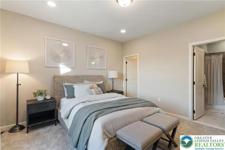 *Photos are of a previously built model and may contain upgrades not included in the base price* Guest Bedroom