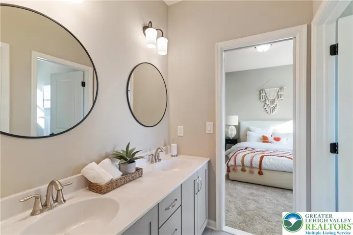 *Photos are of a previously built model and may contain upgrades not included in the base price* J&J Bathroom