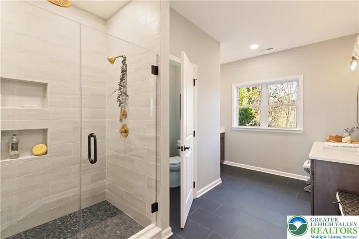 *Photos are of a previously built model and may contain upgrades not included in the base price* Owner's Bath