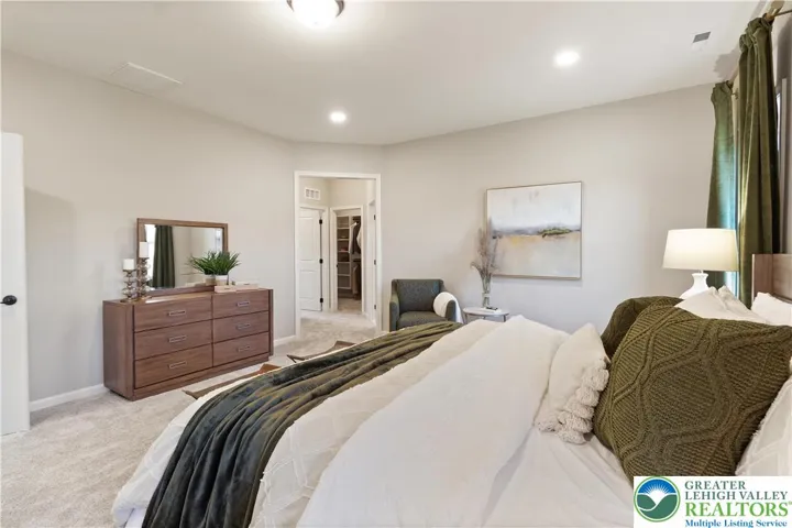 *Photos are of a previously built model and may contain upgrades not included in the base price* Owner's Bedroom