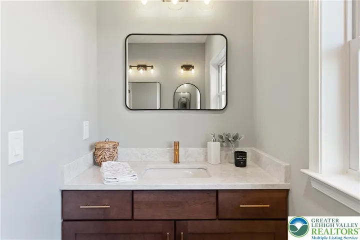 *Photos are of a previously built model and may contain upgrades not included in the base price* Owner's Bath