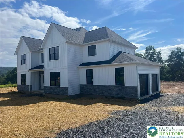 Drywall and painted garage, insulated doors, and two car door openers all included!