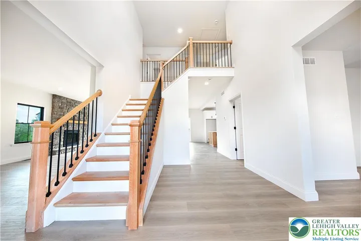 Beautiful oak staircase with modern iron balusters.