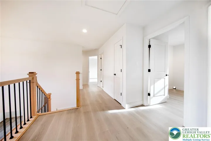 No carpeting in this home. Beautiful flooring throughout.