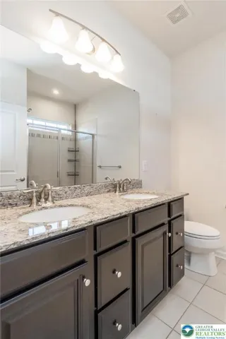 Primary bathroom with two sinks vanity