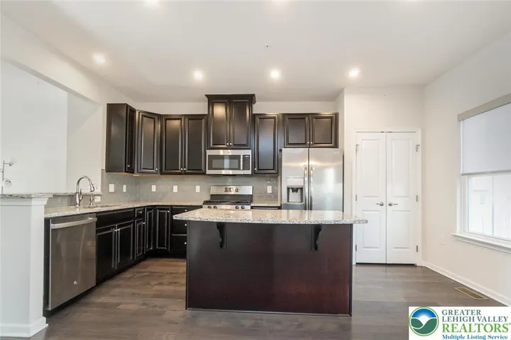 Beautiful kitchen with stainless steel appliances and granite countertops