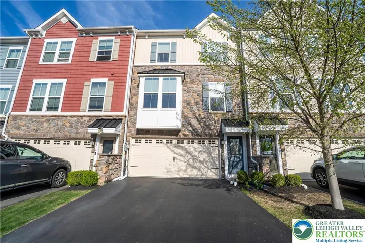 Middle townhome right of red siding townhome