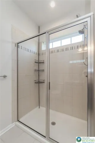 tiled shower in Primary bathroom