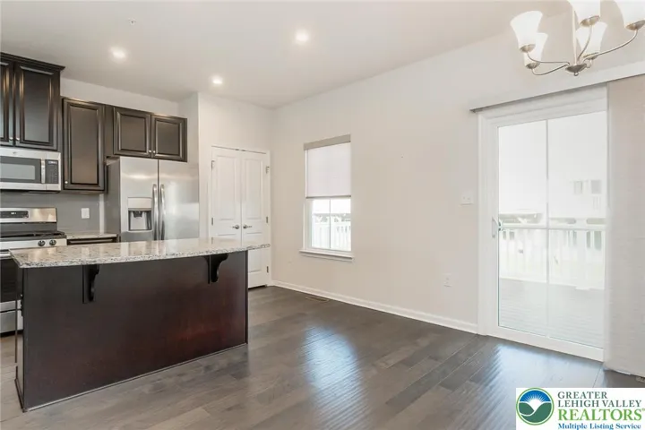 Center island breakfast bar - open to dining area with sliding doors leading out to 12 x 18 deck