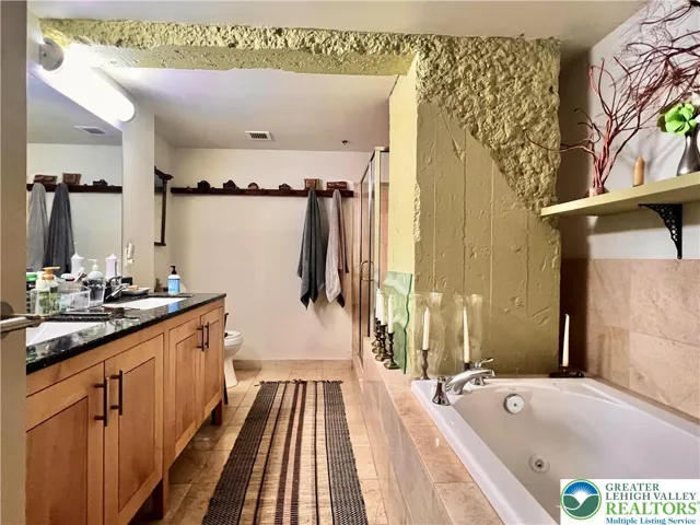 Beautiful granite counters in primary bath.