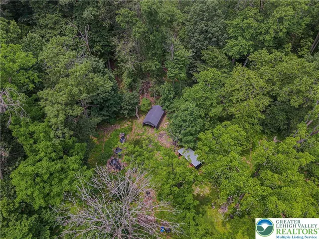 Aerial view of backyard near the wooded area