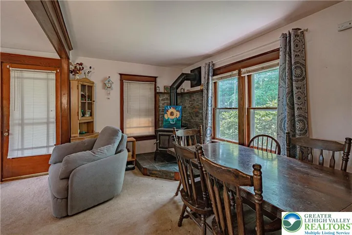 Living and dining room with wood stove