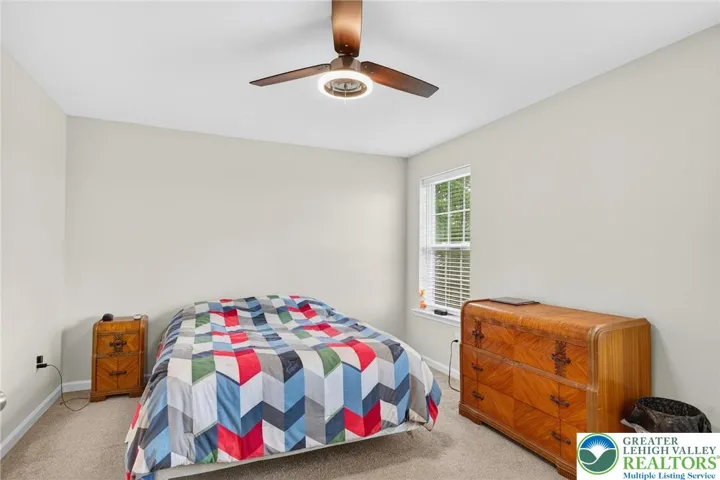 Primary Bedroom w/ Walk-in Closet and Primary Full Bathroom