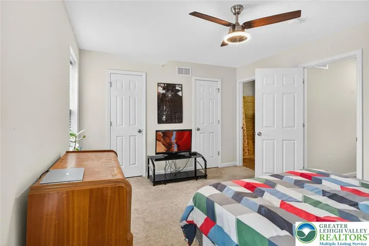 Primary Bedroom w/ Walk-in Closet and Primary Full Bathroom