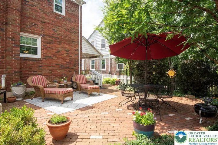 Gorgeous backyard with custom 21' diameter brick patio.