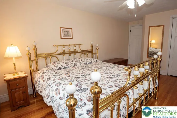Primary Bedroom - great hardwood floors, closet at right.