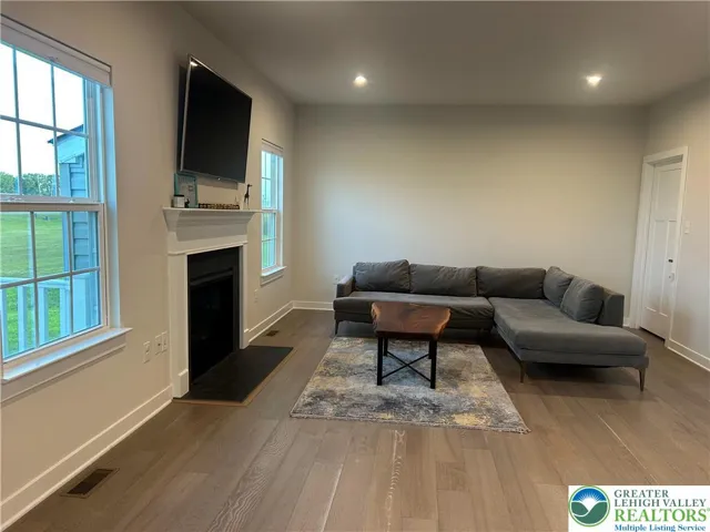 Open concept family room with recessed lights