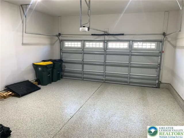Wide garage door with windows, epoxy painted floor