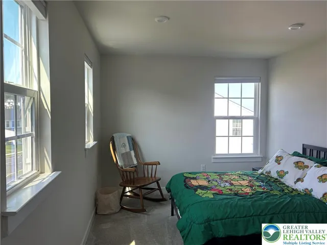 Bedroom 2 has 3 windows and a walk in closet 
