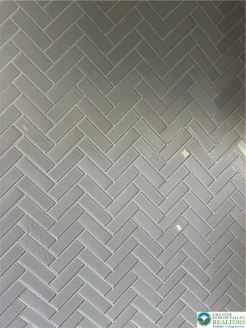 Glass herringbone backsplash