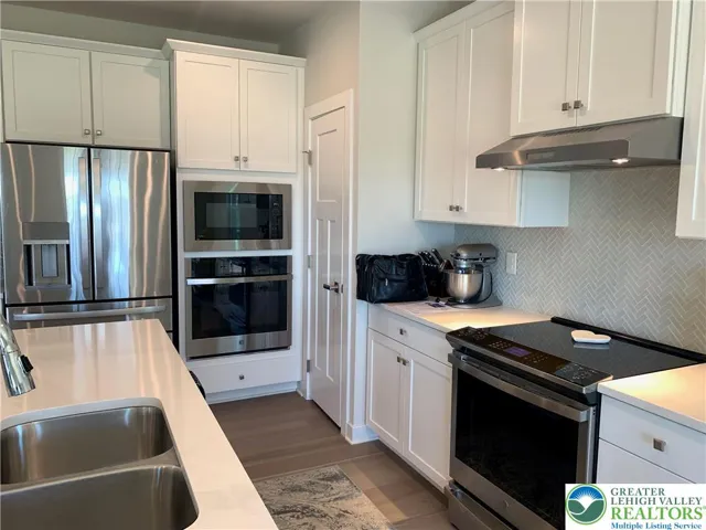 Wall oven, built in microwave, range hood and pantry closet