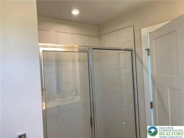 5' shower with tiled walls