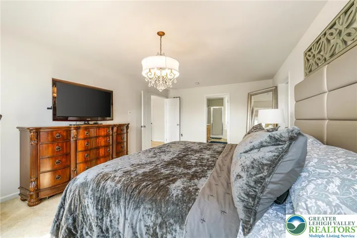 Primary bedroom with double door entry