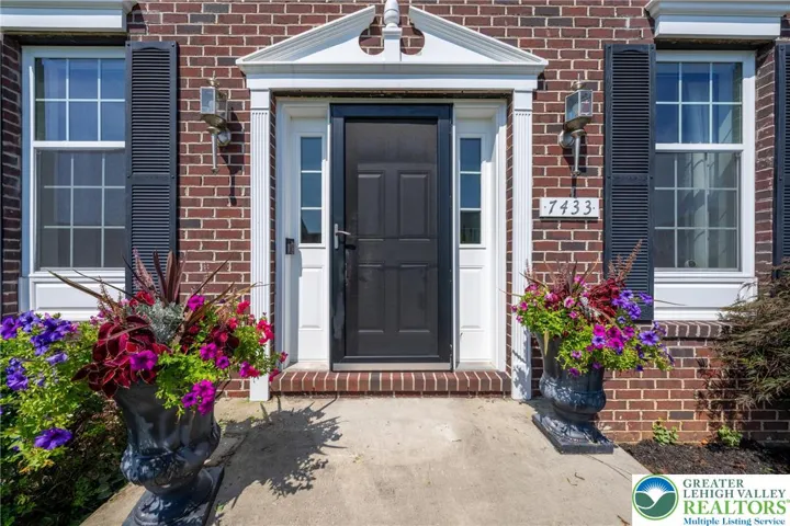 Sunny front porch with storm door